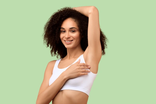 A women showing her smooth underarms free from pimples