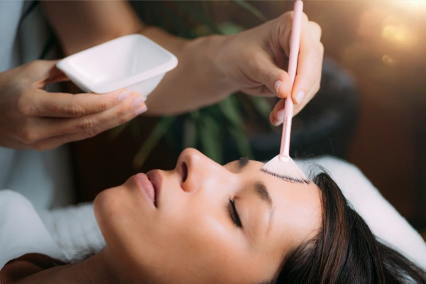 A women taking chemical peel treatment