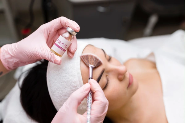 A women taking chemical peel treatment for black spots treatment
