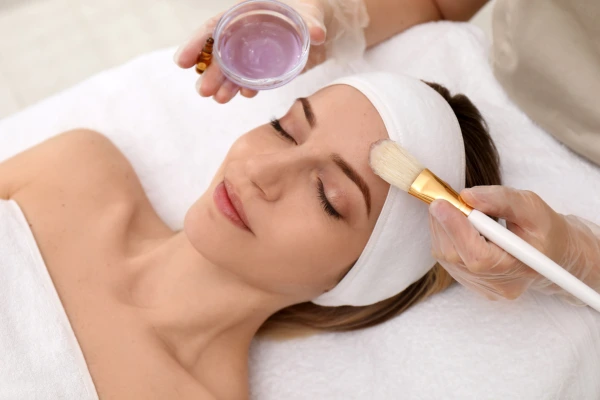 A women taking chemical peel treatment