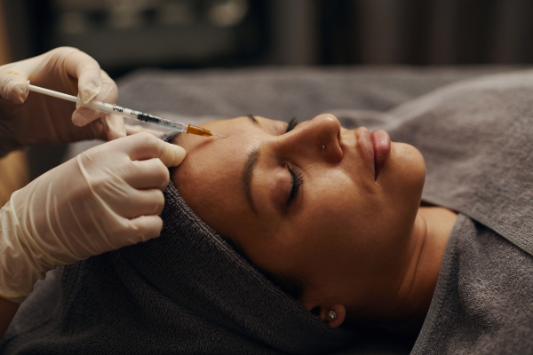A women taking anti wrinkle injections